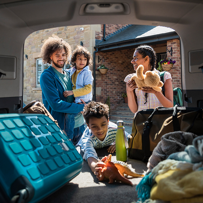 family packing the back of the car